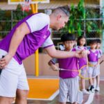 Teaching students how to play badminton