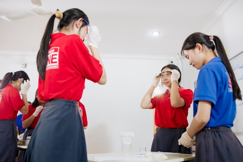 GAC Student putting safety first during a science experiment.